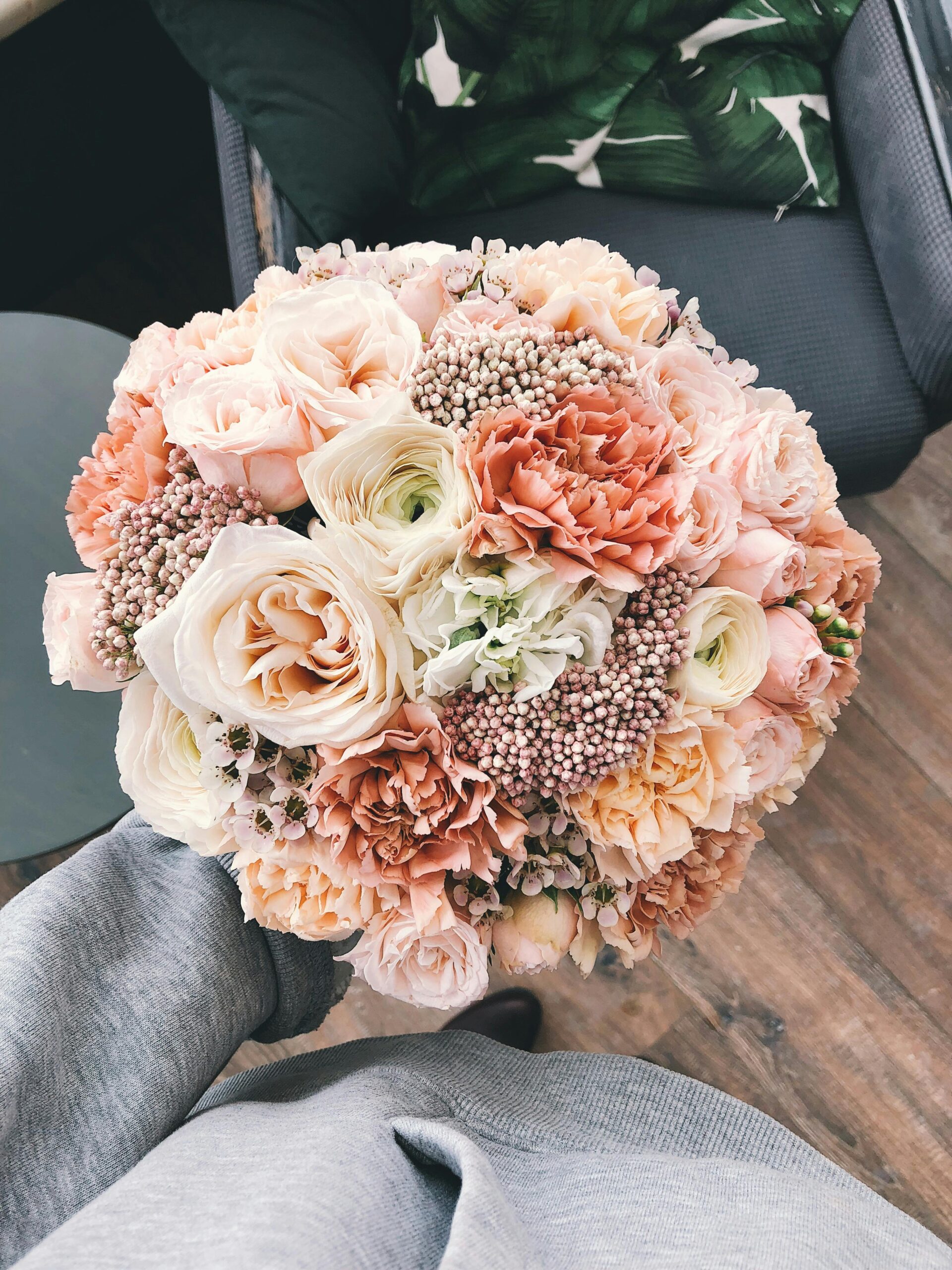 Beautiful bouquet featuring peach and ivory roses, ideal for weddings or romantic occasions.